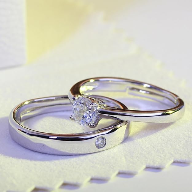 “A pair of couple rings silver with adjustable design, slim band widths, presented in a signature Peora gift box”