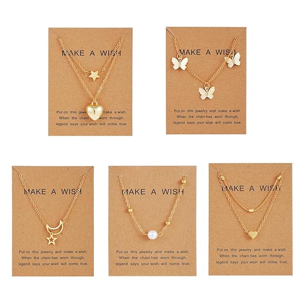 5-piece pearl necklace set with heart, butterfly, and pendant designs.
